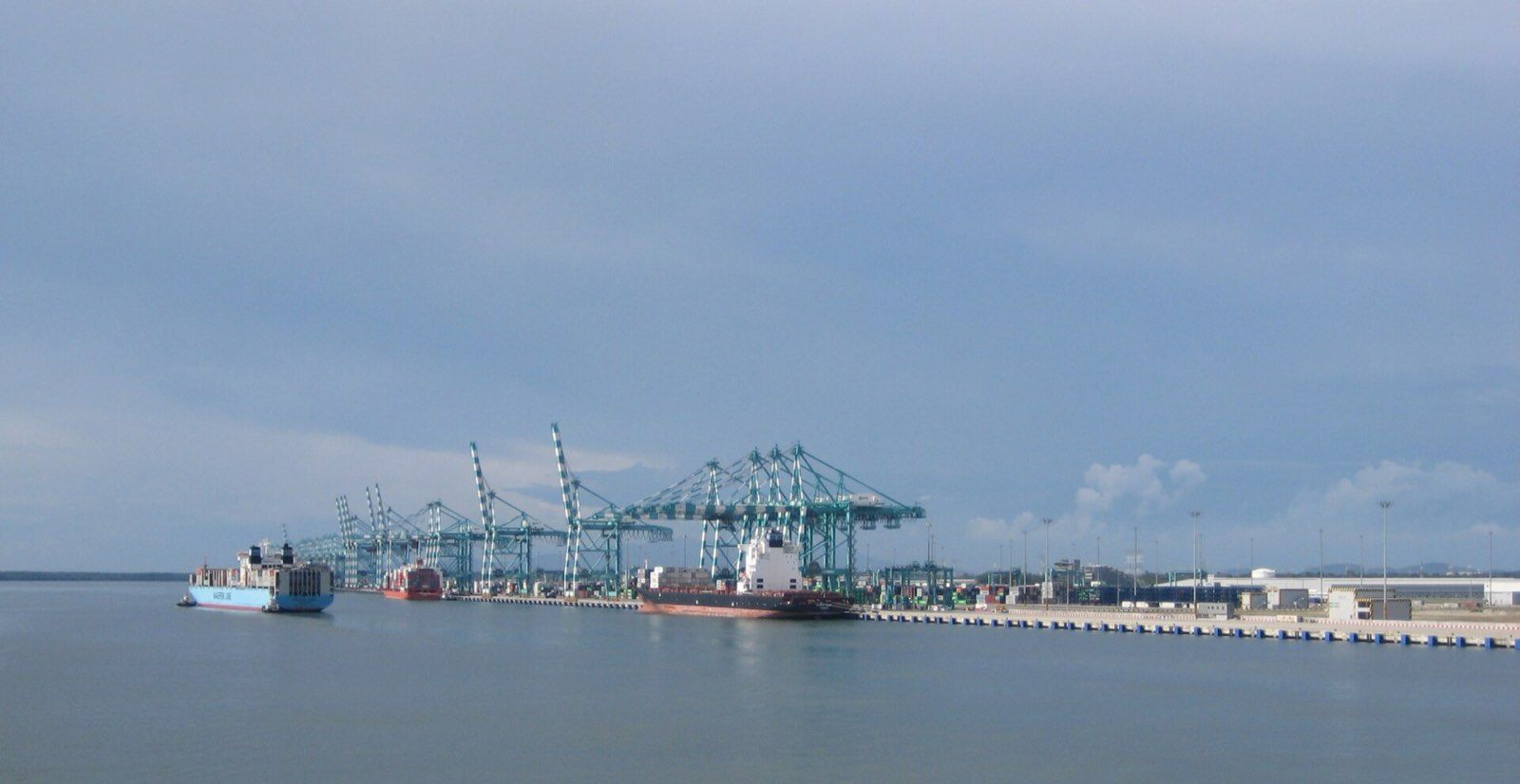 Container cranes and ships at the Port of Tanjung Pelepas in Johor, Malaysia, seen from the water